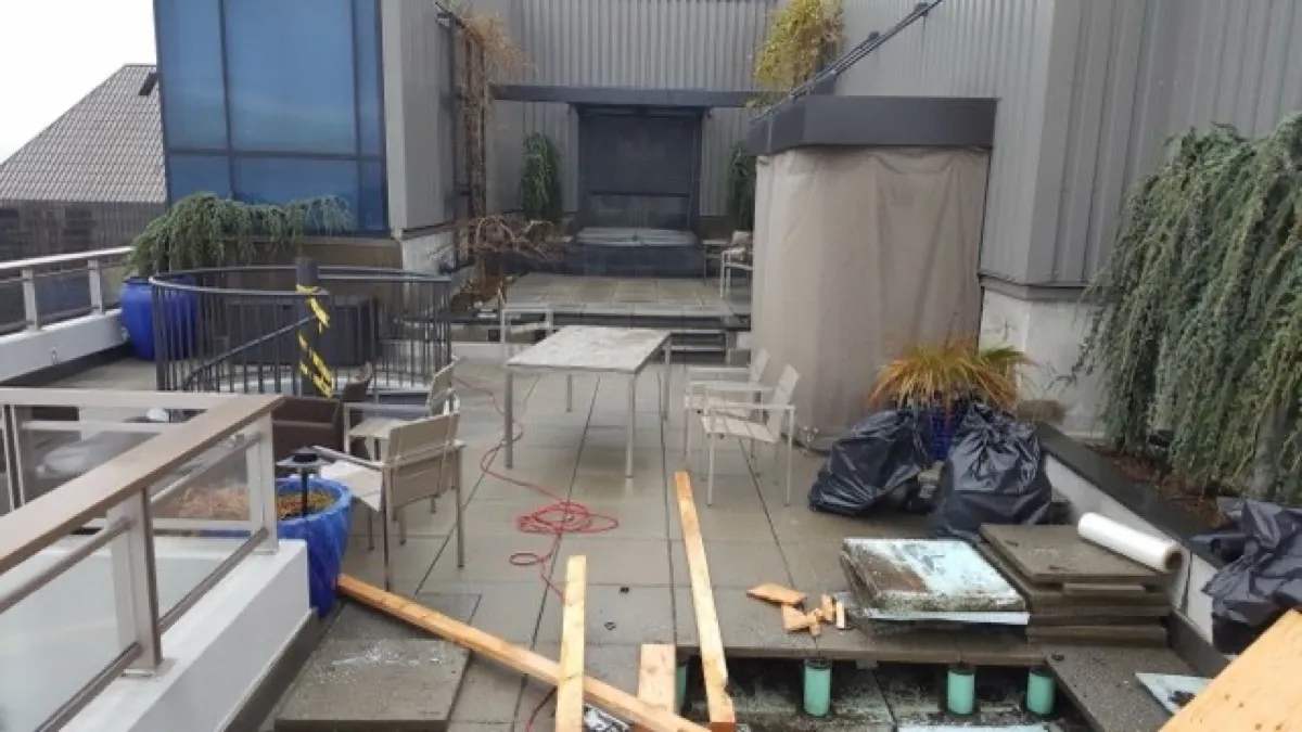 Rooftop patio with fireplace by All Custom Building